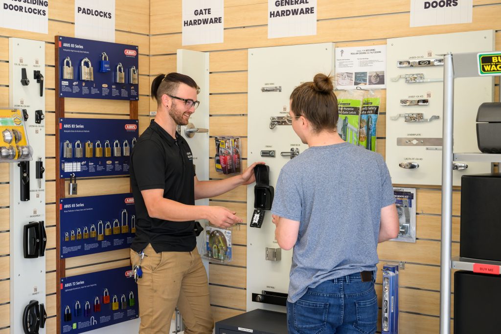 a team member helping a customer with a lockbox